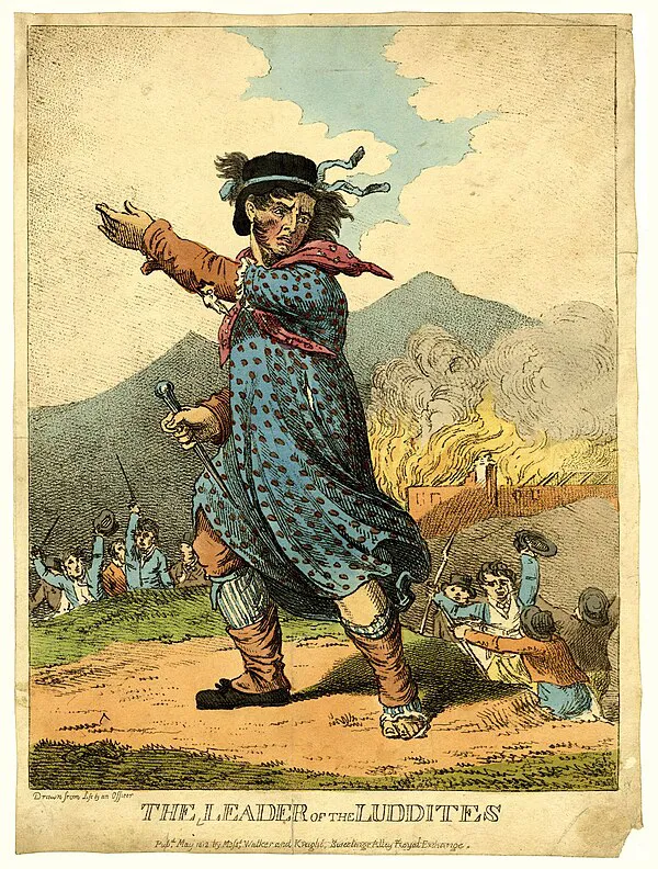 The Leader of the Luddites, an 1812 hand-coloured etching depicting an armed figure in women's clothing before a burning building.
